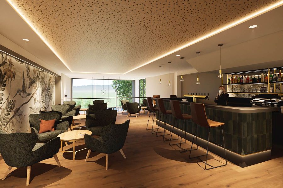 Hotelbar Churfürstenhof Bad Birnbach mit hoher Bestuhlung Ledersesseln und runden Beistelltischen für Gäste