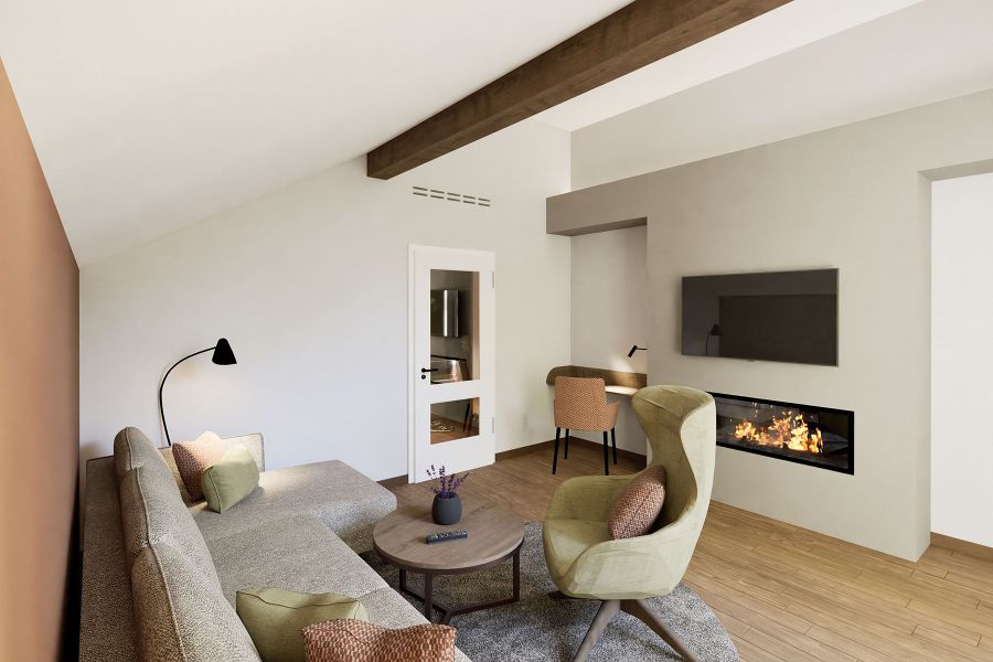 Wohnbereich im Zimmer Churfürst Komfort mit Kamin und gemütlichem Ohrensessel