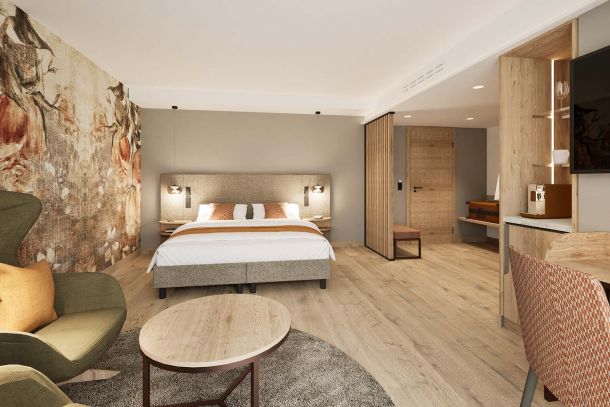 Modernes Zimmerkonzept Prinzess-Zimmer Churfürstenhof Bad Birnbach kombiniert helles Bettkopfteil schwebende Nachtkästchen und warme Akzentbeleuchtung