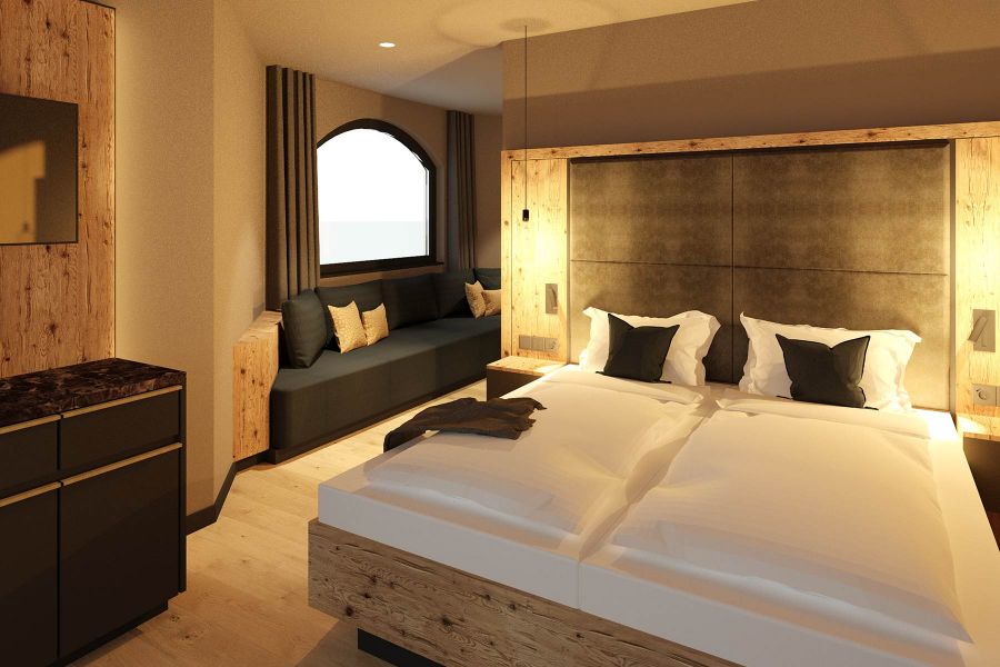 Hotel furnishings with double bed and sofa in the Hotel Waldfriede