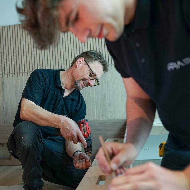 Appia carpenters assemble hotel furniture