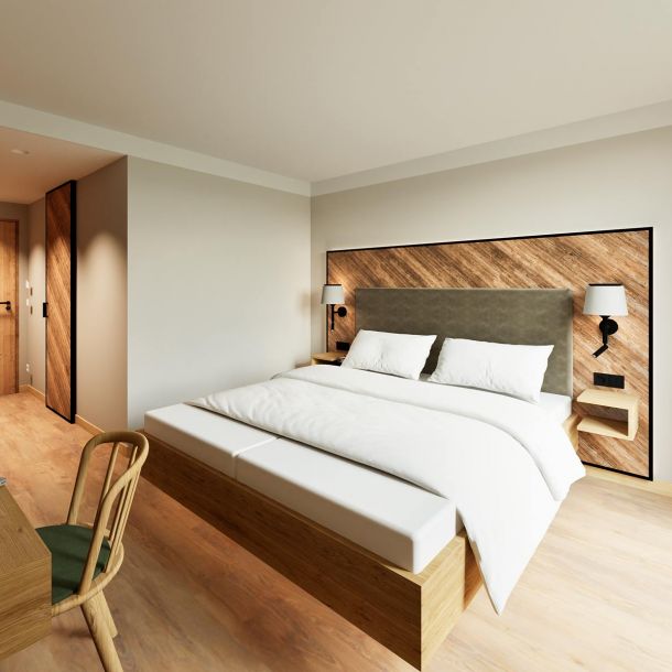 Schlafzimmer mit einem Bettkopfteil in Holzoptik