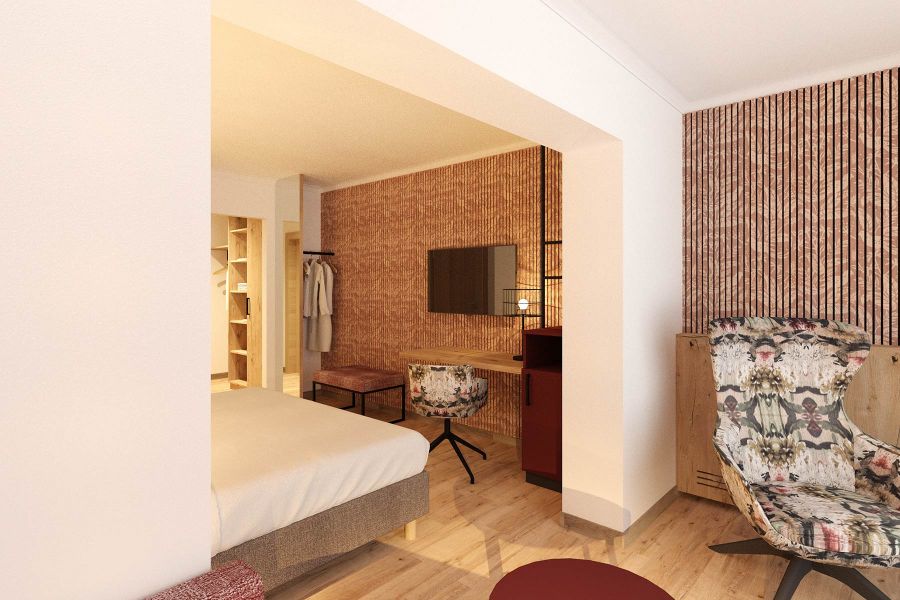 Hotel Zimmereinrichtung mit buntem Sessel und Schreibtisch