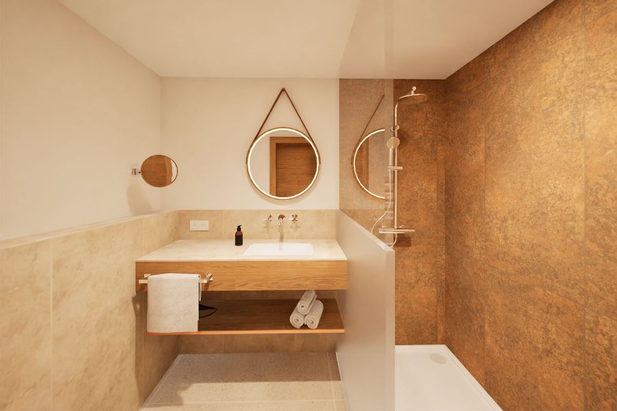 Begehbare Dusche mit Einzelwaschtisch im Hotel & Brauereigasthof Drei Kronen Memmelsdorf in orangen Kupfertönen und Stein